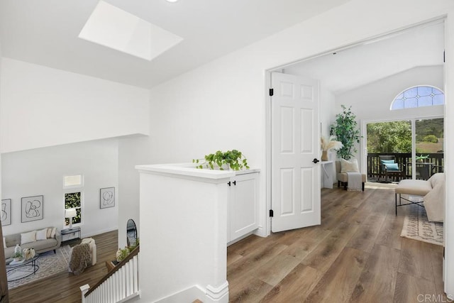 1707 Willowhaven Rd, Encinitas, CA 92024 - hallway featuring lofted ceiling, a skylight, and wood finished floors