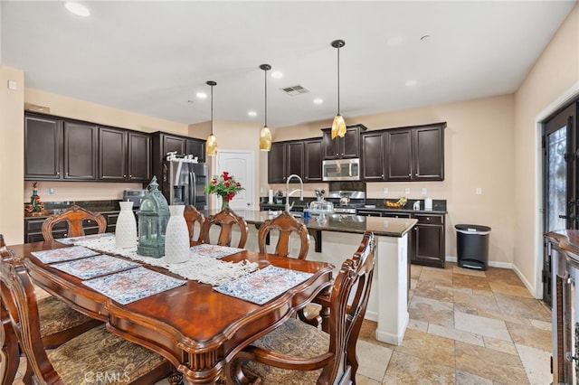 5801 S Moonstone Peak Dr, Bakersfield, CA 93313 - dining area featuring stone tile flooring, recessed lighting, and baseboards