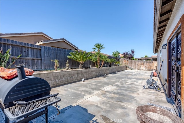 5801 S Moonstone Peak Dr, Bakersfield, CA 93313 - view of patio featuring a fenced backyard and grilling area