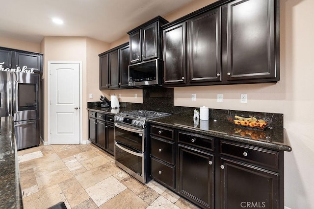 5801 S Moonstone Peak Dr, Bakersfield, CA 93313 - kitchen with stainless steel appliances, stone tile floors, dark stone counters, and recessed lighting
