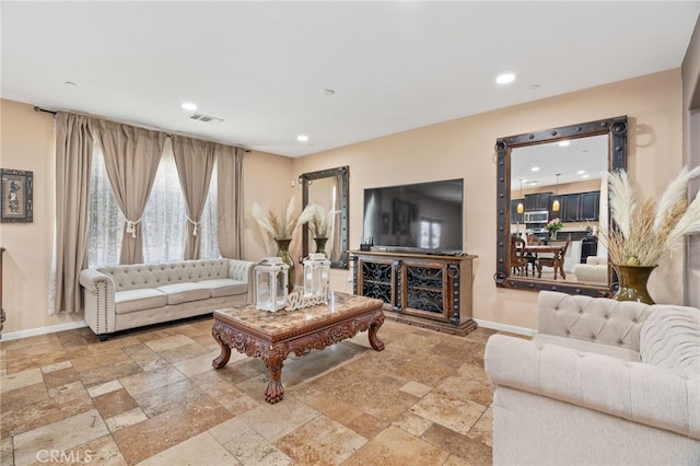 5801 S Moonstone Peak Dr, Bakersfield, CA 93313 - living area featuring stone tile floors and recessed lighting