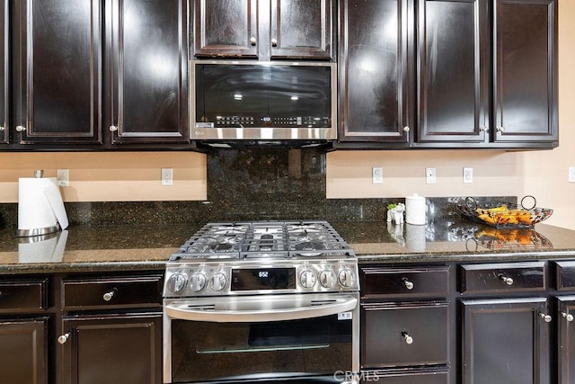 5801 S Moonstone Peak Dr, Bakersfield, CA 93313 - kitchen with appliances with stainless steel finishes, dark brown cabinetry, decorative backsplash, and dark stone counters