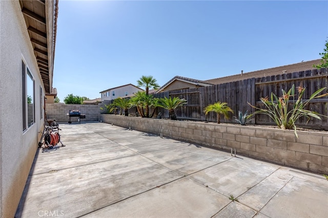 5801 S Moonstone Peak Dr, Bakersfield, CA 93313 - view of patio / terrace with a fenced backyard and area for grilling