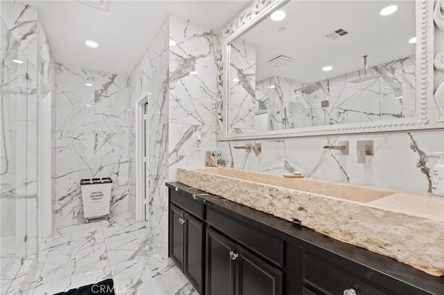 5801 S Moonstone Peak Dr, Bakersfield, CA 93313 - full bath featuring recessed lighting, tile walls, marble tiled floors, a marble finish shower, and vanity