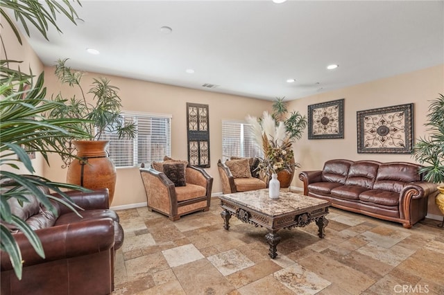 5801 S Moonstone Peak Dr, Bakersfield, CA 93313 - living area with stone tile floors, recessed lighting, and baseboards