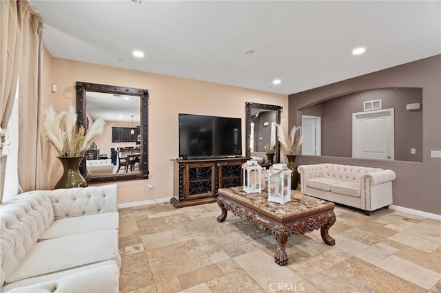 5801 S Moonstone Peak Dr, Bakersfield, CA 93313 - living area featuring baseboards, stone tile flooring, and recessed lighting