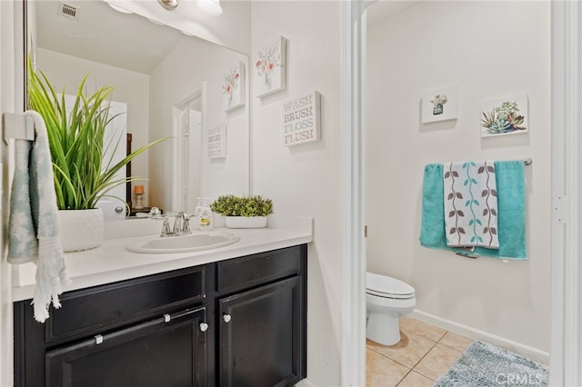 5801 S Moonstone Peak Dr, Bakersfield, CA 93313 - bathroom with tile patterned floors, vanity, toilet, and baseboards
