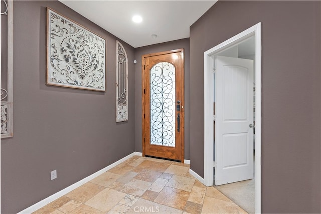 5801 S Moonstone Peak Dr, Bakersfield, CA 93313 - foyer with baseboards and stone tile flooring