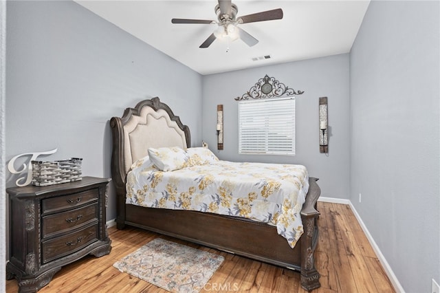 5801 S Moonstone Peak Dr, Bakersfield, CA 93313 - bedroom with wood finished floors, baseboards, and ceiling fan