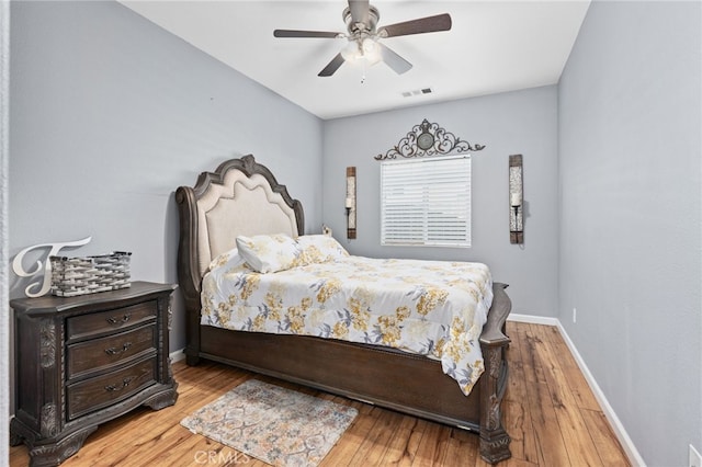 5801 S Moonstone Peak Dr, Bakersfield, CA 93313 - bedroom with hardwood / wood-style floors and a ceiling fan
