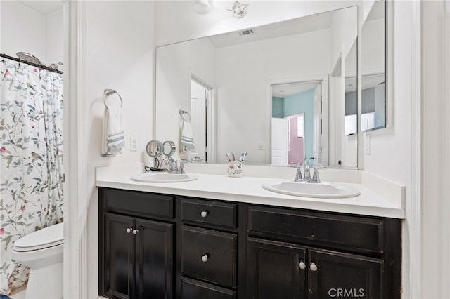 5801 S Moonstone Peak Dr, Bakersfield, CA 93313 - full bathroom with double vanity and a shower with curtain