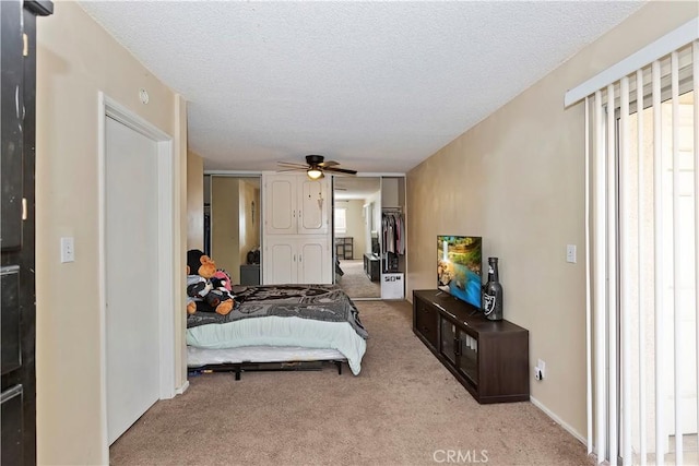 16193 Colina St, Victorville, CA 92395 - bedroom featuring carpet, a closet, a ceiling fan, and a textured ceiling