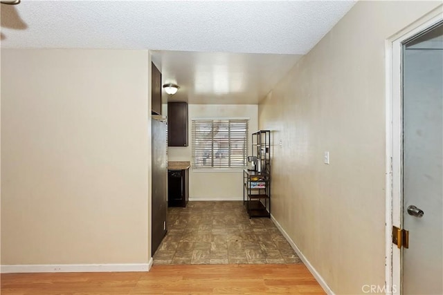 16193 Colina St, Victorville, CA 92395 - hallway with parquet flooring, baseboards, and a textured ceiling