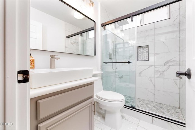 23839 Rio Ranch Way, Valencia, CA 91354 - bathroom with marble look tile flooring, a stall shower, vanity, and toilet