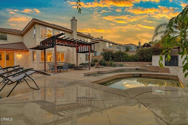 23839 Rio Ranch Way, Valencia, CA 91354 - pool at dusk featuring an in-ground hot tub, a patio area, fence, and a pergola