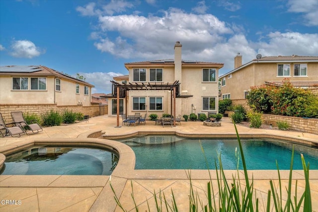 23839 Rio Ranch Way, Valencia, CA 91354 - back of property featuring a pergola, a chimney, stucco siding, solar panels, and a patio