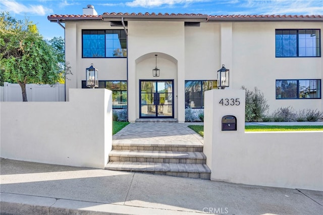 4335 Chaumont Rd, Woodland Hills, CA 91364 - view of exterior entry with fence and stucco siding
