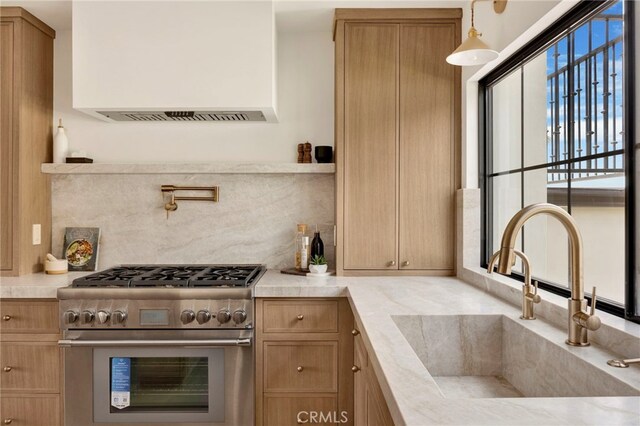 4335 Chaumont Rd, Woodland Hills, CA 91364 - kitchen featuring high end stove, wall chimney range hood, a sink, and tasteful backsplash