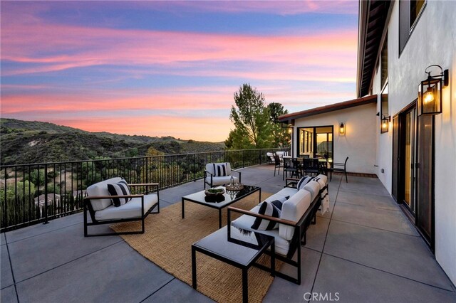 4335 Chaumont Rd, Woodland Hills, CA 91364 - patio terrace at dusk with an outdoor living space and outdoor dining space