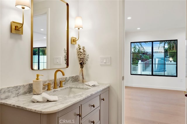 4335 Chaumont Rd, Woodland Hills, CA 91364 - bathroom featuring plenty of natural light, wood finished floors, recessed lighting, vanity, and baseboards