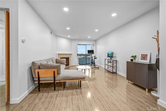 460 Oak St Unit 316, Glendale, CA 91204 - living area with wood finished floors, baseboards, recessed lighting, and a glass covered fireplace