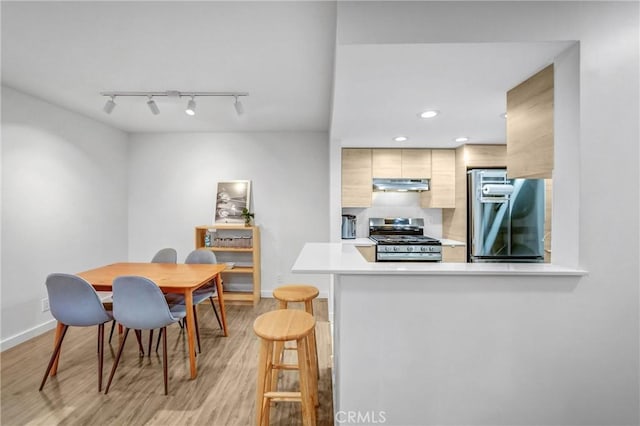 460 Oak St Unit 316, Glendale, CA 91204 - dining space with rail lighting, baseboards, light wood finished floors, and recessed lighting