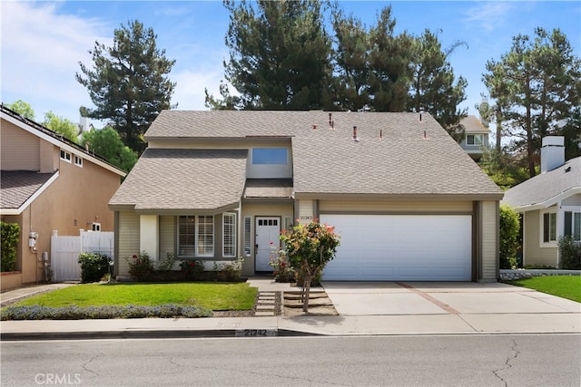 21242 Bristlecone, Mission Viejo, CA 92692 - view of front of home featuring an attached garage, concrete driveway, and roof with shingles