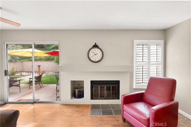 21242 Bristlecone, Mission Viejo, CA 92692 - living room featuring a tile fireplace, wood finished floors, and ceiling fan