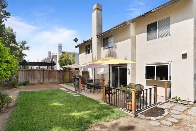 21242 Bristlecone, Mission Viejo, CA 92692 - back of house with stucco siding, a patio, and a chimney