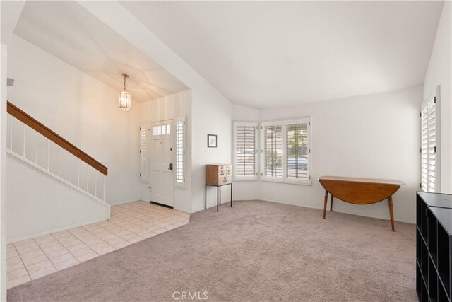 21242 Bristlecone, Mission Viejo, CA 92692 - foyer entrance featuring vaulted ceiling, carpet, stairway, and tile patterned flooring