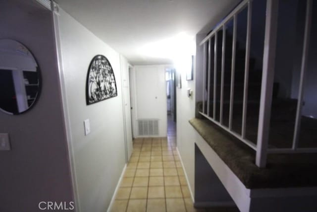 19555 Chadway St, Canyon Country, CA 91351 - hallway featuring light tile patterned floors and baseboards