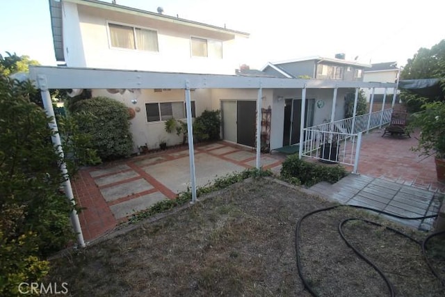 19555 Chadway St, Canyon Country, CA 91351 - rear view of property featuring stucco siding and a patio
