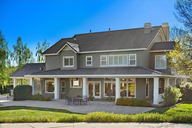 38161 Butterfly Ct, Yucaipa, CA 92399 - back of house with a ceiling fan, a chimney, a tile roof, and a patio area