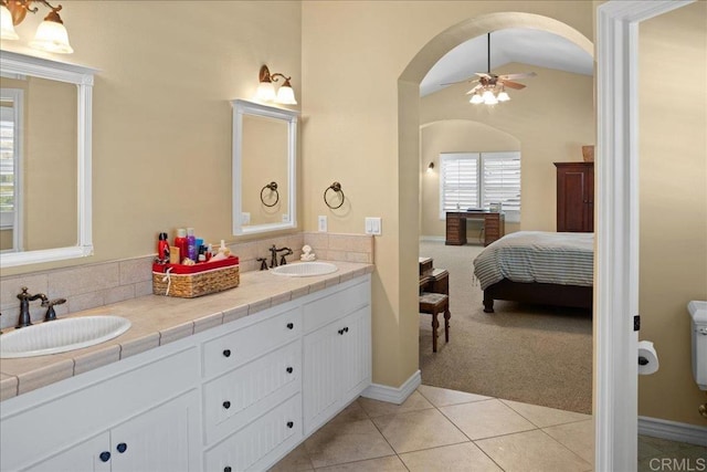 38161 Butterfly Ct, Yucaipa, CA 92399 - ensuite bathroom with ceiling fan, tile patterned flooring, double vanity, tasteful backsplash, and lofted ceiling