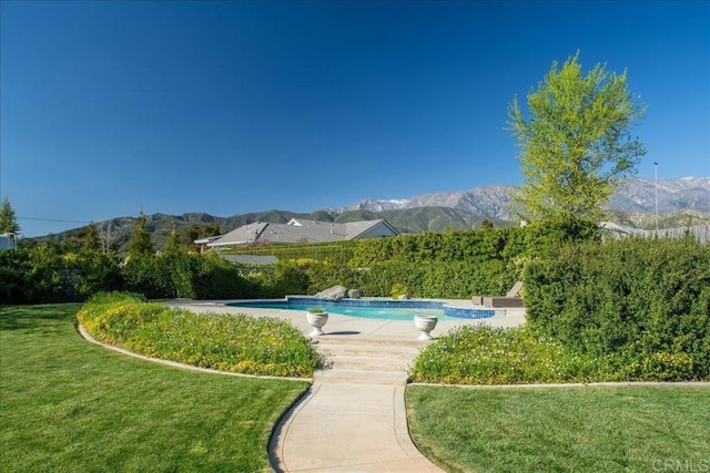 38161 Butterfly Ct, Yucaipa, CA 92399 - view of swimming pool featuring a mountain view and a yard