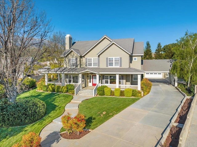 38161 Butterfly Ct, Yucaipa, CA 92399 - view of front facade with a porch, a chimney, a front yard, and a garage