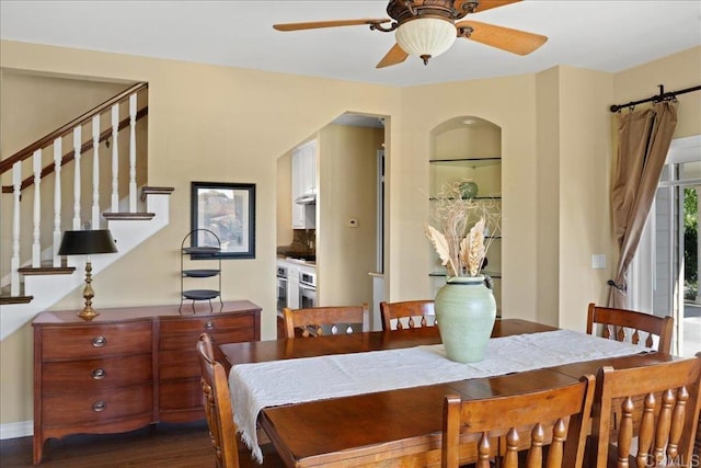 38161 Butterfly Ct, Yucaipa, CA 92399 - dining area featuring ceiling fan, stairway, and dark wood-type flooring