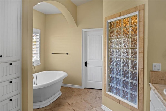 38161 Butterfly Ct, Yucaipa, CA 92399 - bathroom featuring a freestanding bath, tile patterned flooring, and baseboards