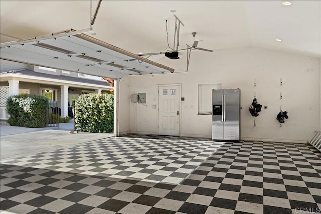38161 Butterfly Ct, Yucaipa, CA 92399 - garage with stainless steel fridge, a garage door opener, and recessed lighting