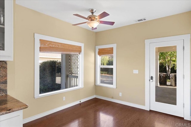 38161 Butterfly Ct, Yucaipa, CA 92399 - unfurnished dining area with dark wood finished floors, baseboards, and ceiling fan