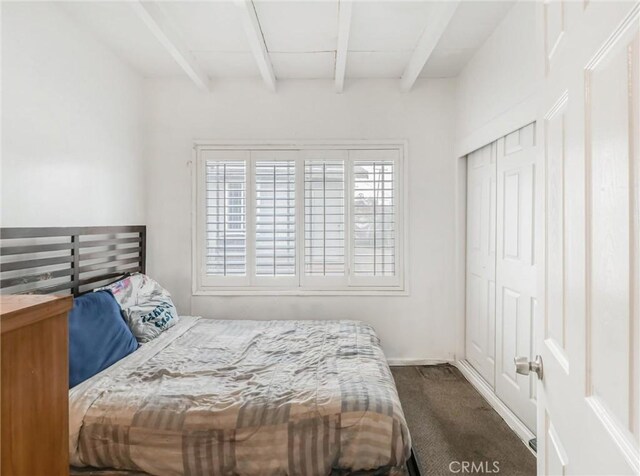 1401 W 165th St, Compton, CA 90220 - bedroom featuring beam ceiling, dark colored carpet, and a closet