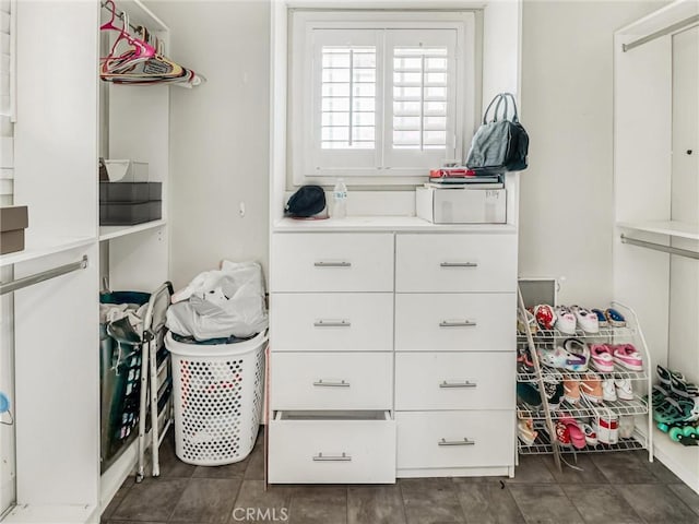 1401 W 165th St, Compton, CA 90220 - spacious closet featuring dark tile patterned floors