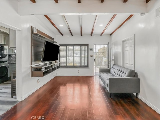 1401 W 165th St, Compton, CA 90220 - living area featuring wood finished floors, beamed ceiling, baseboards, estacked washer and dryer, and recessed lighting
