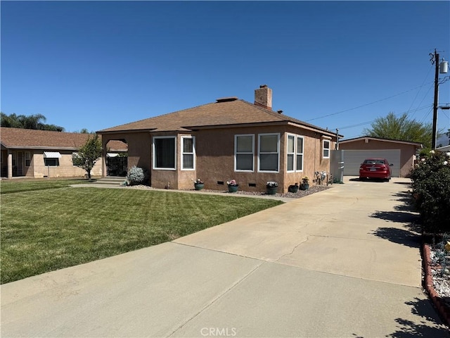 34662 Turner Ln, Yucaipa, CA 92399 - view of front facade with an outdoor structure, a front lawn, a garage, a shingled roof, and a chimney