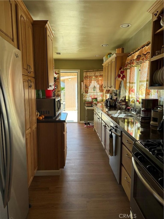 34662 Turner Ln, Yucaipa, CA 92399 - kitchen featuring stainless steel appliances, a sink, dark wood-style flooring, and brown cabinets