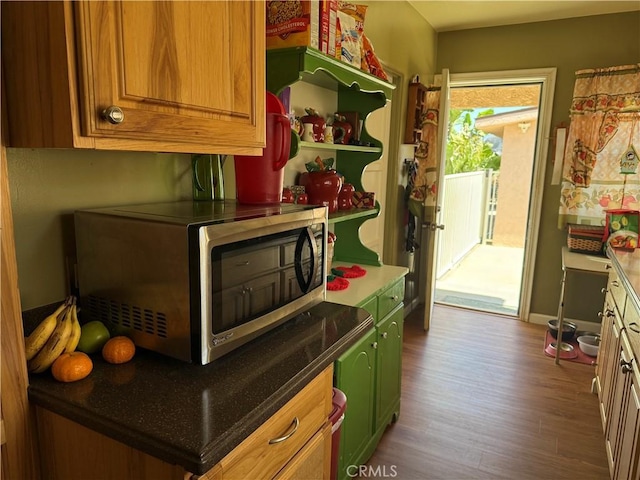 34662 Turner Ln, Yucaipa, CA 92399 - kitchen featuring stainless steel microwave, wood finished floors, brown cabinetry, and green cabinetry