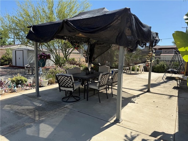 34662 Turner Ln, Yucaipa, CA 92399 - view of patio featuring outdoor dining space, a shed, an outbuilding, and fence