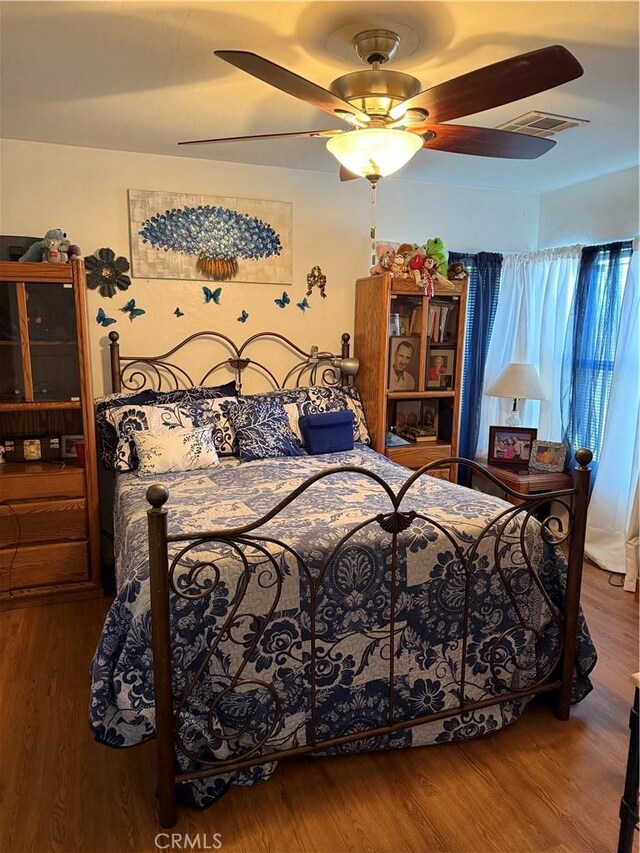 34662 Turner Ln, Yucaipa, CA 92399 - bedroom with wood finished floors and ceiling fan