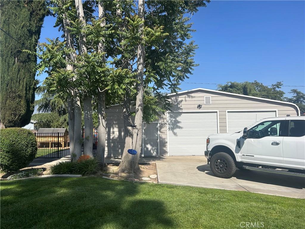 12630 Maple Ct, Yucaipa, CA 92399 - view of home's exterior with concrete driveway and a garage