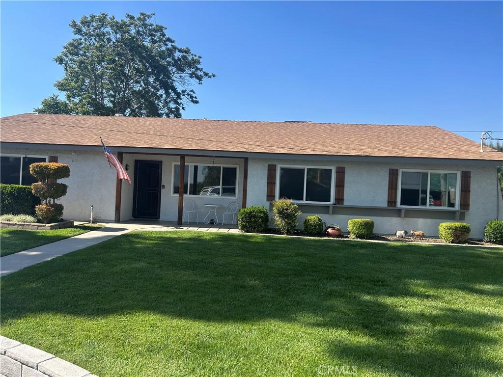 12630 Maple Ct, Yucaipa, CA 92399 - ranch-style house featuring a front yard, stucco siding, and a shingled roof